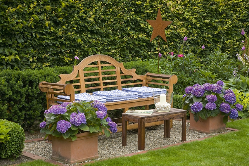 Outdoor room bordered with European Beech and shorter yew hedge